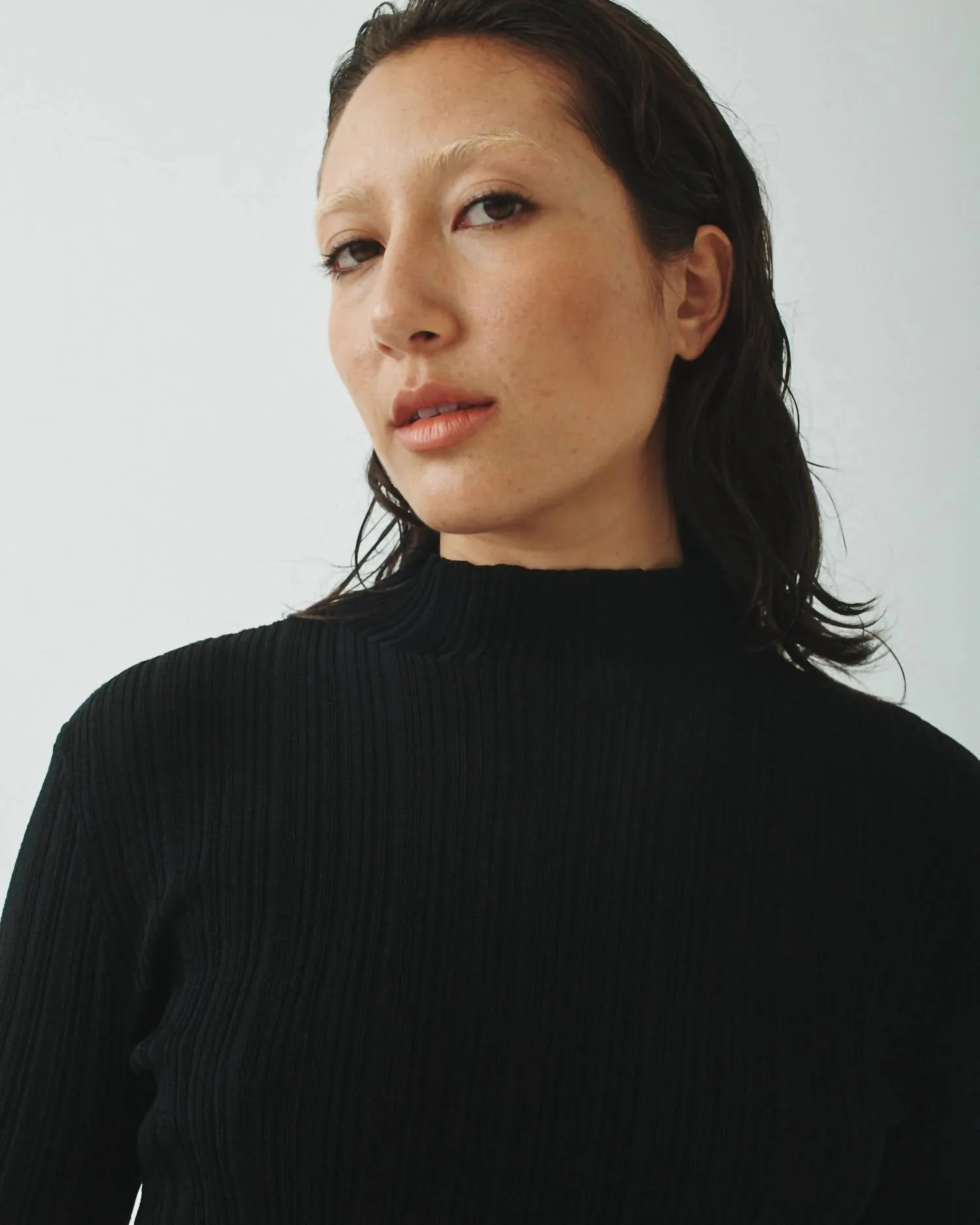 Pleated Mock Neck Sweater In Black